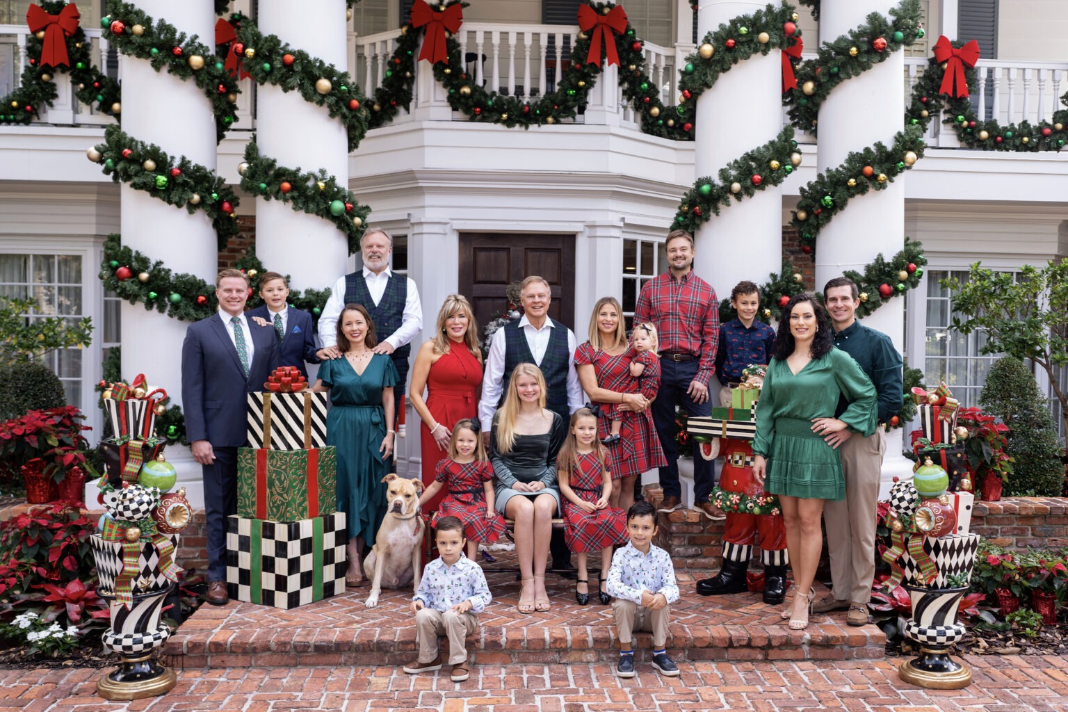 It's the most wonderful time of the year for this large Lost Tree Village family as they gather together for their annual holiday family photo shoot outside their lavishly decorated home where family photographer David Scarola, top rated portrait artist, has posed the entire family. This photograph is of a Seminole Landing family, in fact, not a Lost Tree Village Family.