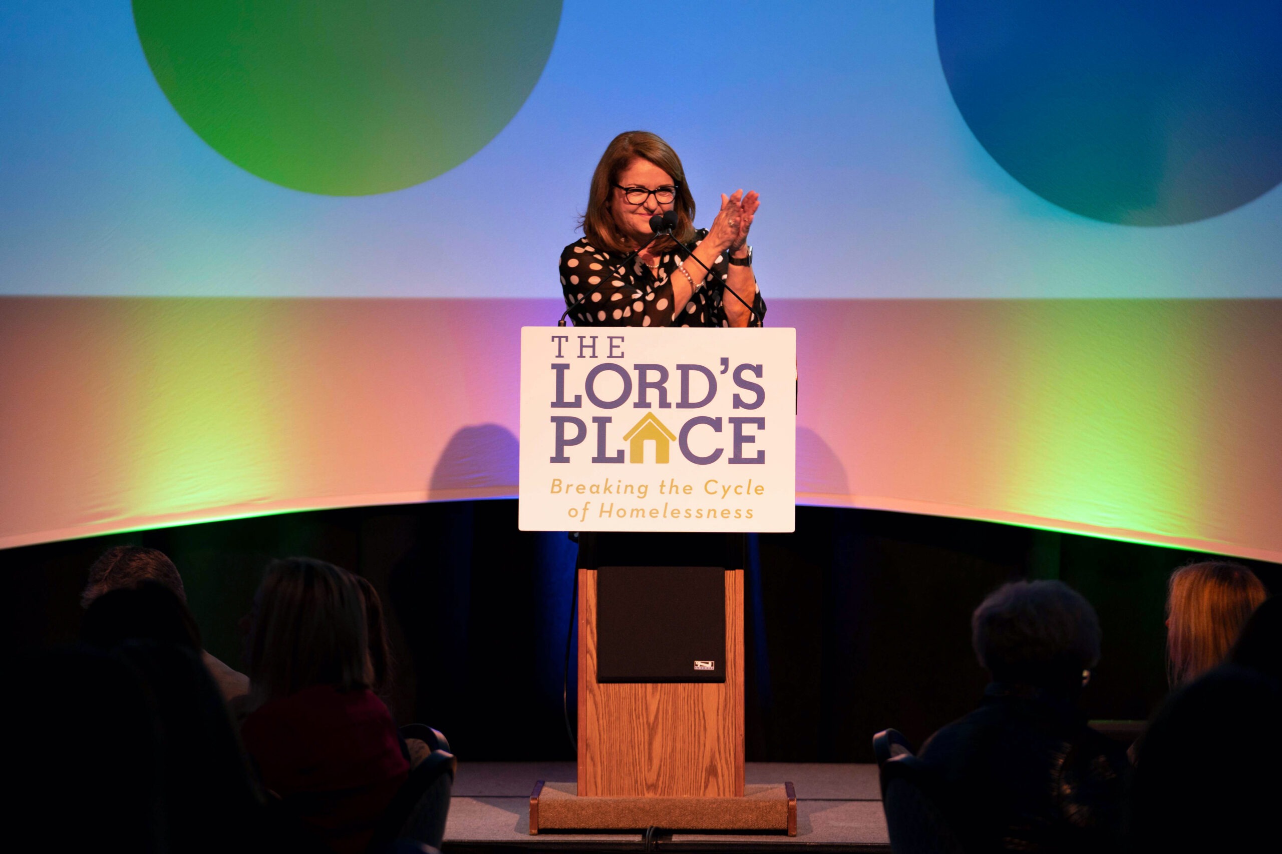Diana Stanley, CEO of The Lord’s Place, speaking passionately at the annual fundraising breakfast held at the Kravis Center in Palm Beach, Florida, captured by David Scarola Photography.The Lord’s Place, Diana Stanley, Kravis Center Palm Beach, Palm Beach nonprofit photography, fundraising event photography, event photographer Palm Beach, David Scarola Photography, worldwide event photographer, nonprofit storytelling photography, humanitarian event photographer, luxury corporate photographer, best event photographer Florida, fine art event photography, breaking the cycle of homelessness, Palm Beach community events.