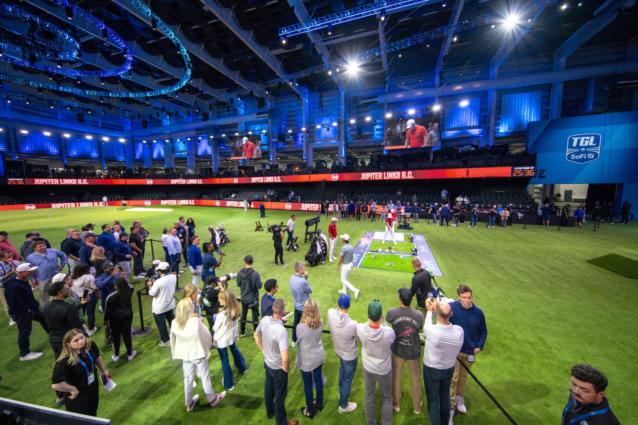 Crowded TGL arena in Palm Beach, Florida — photographed by world-class event photographer David Scarola for Pinpoint Media, capturing the energy and precision of professional golf teams warming up before play.TGL photographer Palm Beach, sports event photography Florida, Pinpoint Media photography, corporate event photographer Palm Beach, worldwide event photographer, golf event photographer, luxury event photographer, David Scarola Photography, sports editorial photography, event photography for brands, professional golf photography, Palm Beach Florida event photographer