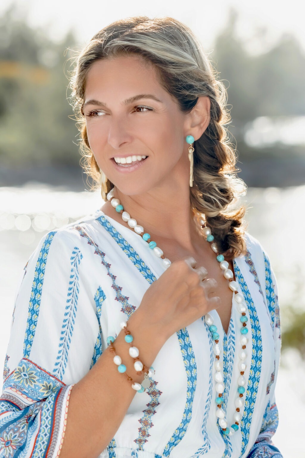 Fashion and jewelry portrait of Molly DeMarcellus, designer and founder of MDem Jewelry, photographed in the Abaco Islands, Marsh Harbour by David Scarola, one of Florida’s premier fashion and lifestyle photographers. The image showcases her wearing handcrafted active jewelry made for the modern, vacationing woman — featuring turquoise, pearl, and gold pieces that embody coastal sophistication and effortless island elegance.