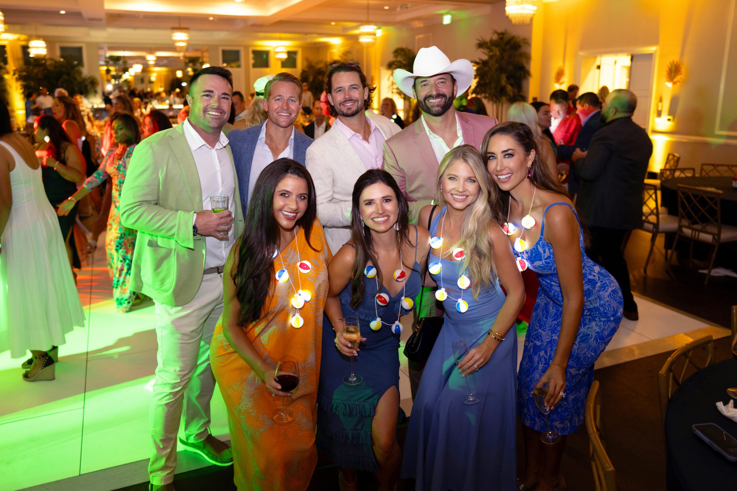 Guests dressed in vibrant colors celebrate at the Live Like Jake Foundation Gala held at the Pelican Club in Jupiter Island, Florida, captured in vivid, joyful tones by David Scarola Photography.Guests dressed in vibrant colors celebrate at the Live Like Jake Foundation Gala held at the Pelican Club in Jupiter Island, Florida, captured in vivid, joyful tones by David Scarola Photography.