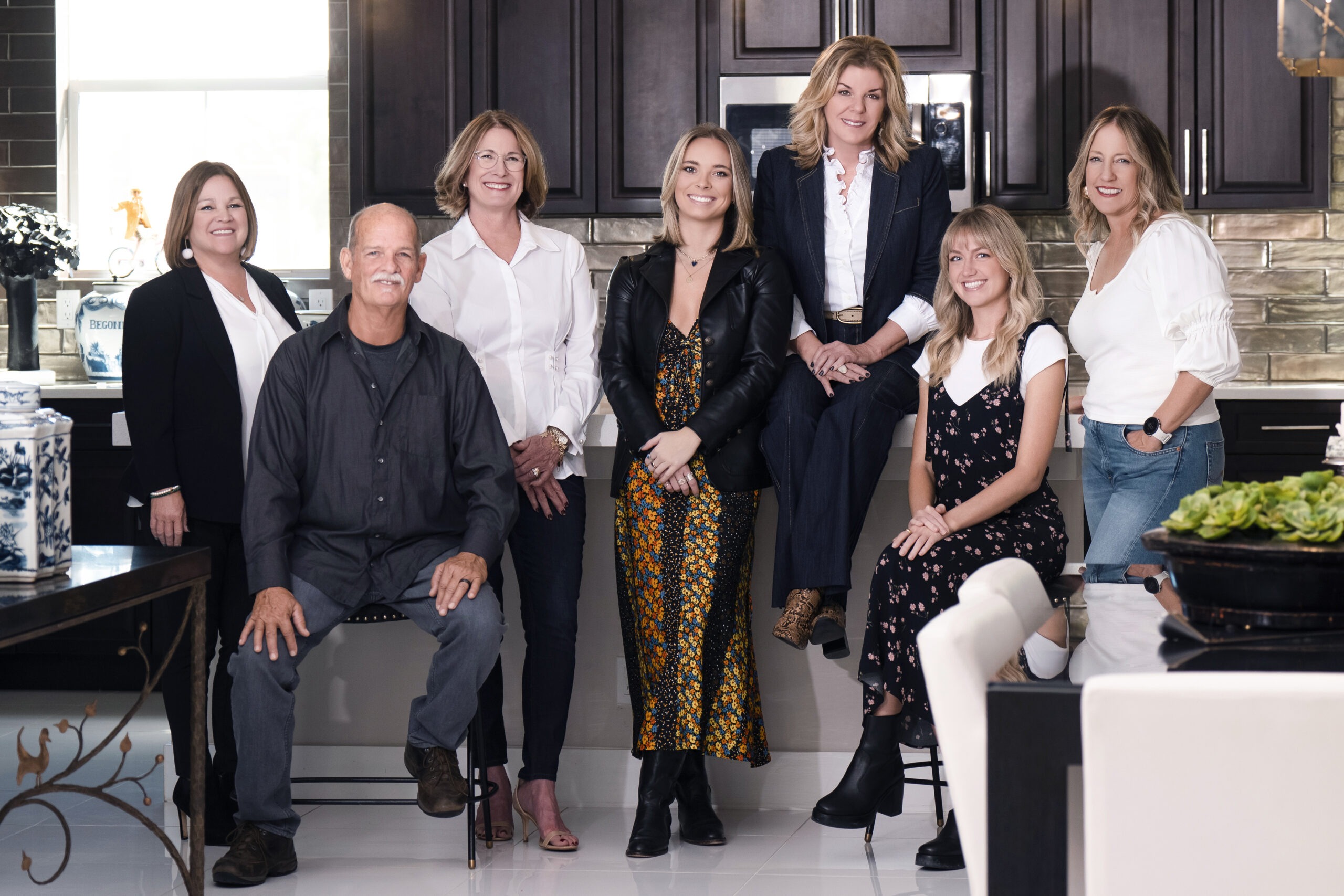 Corporate team portrait of a South Florida interior design firm, photographed in a modern kitchen setting. Seven design professionals, dressed in smart casual and business attire, represent their brand’s creative and professional excellence.interior design team photography, corporate team portraits Palm Beach, business headshots Jupiter Island, professional photography South Florida, creative agency team photo, group photography Miami, lifestyle corporate photographer, brand photography for design firms, Jupiter Island professional portraits, Palm Beach business photography, David Scarola Photography, team branding portraits, architectural and interior design marketing.