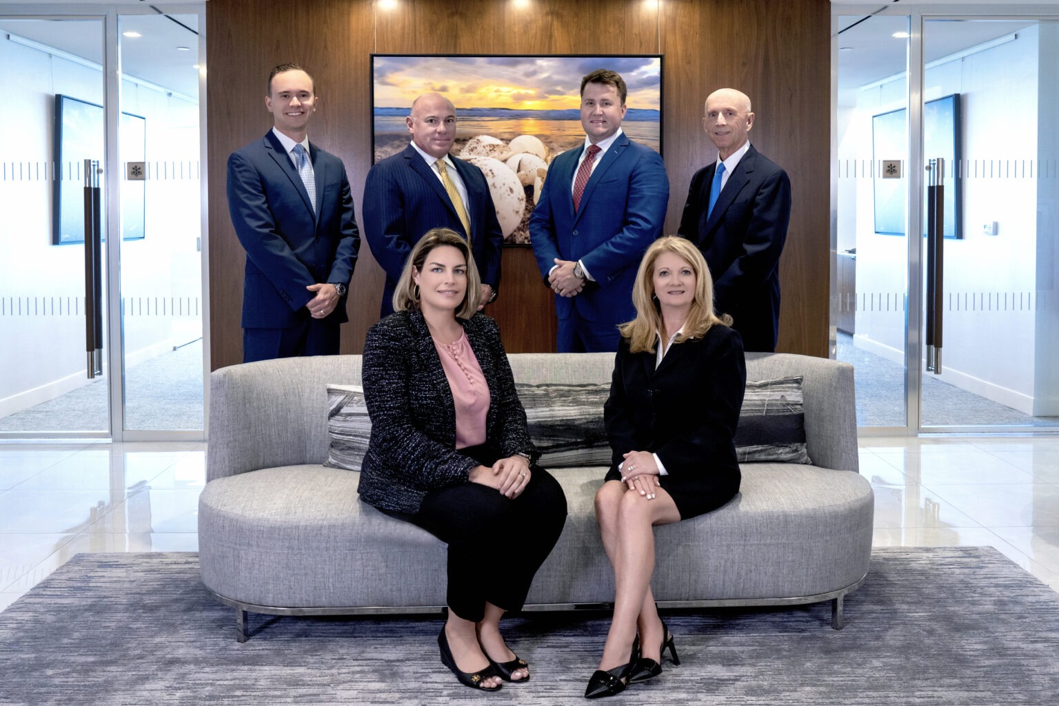 UBS Financial Services team portrait in their Palm Beach office — six professionals dressed in business attire, posed confidently in a modern corporate setting. The photograph highlights leadership, professionalism, and trust, ideal for financial institutions and wealth management firms.UBS Financial Advisors Palm Beach, corporate photography Palm Beach, business portraits South Florida, executive headshots Miami, corporate team photographer Jupiter Island, professional headshots Palm Beach County, financial firm photography, UBS team photo, business photography Miami, corporate branding photography South Florida, Palm Beach professional photographer, business portraits Palm Beach, corporate marketing photography, David Scarola Photography.