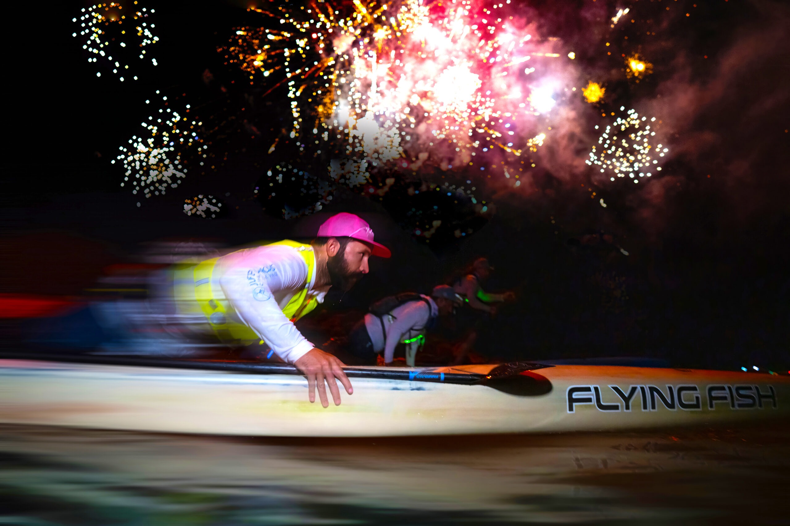 Official launch of The Crossing for Cystic Fibrosis — midnight fireworks illuminate paddlers departing from Bimini on their 81-mile ocean journey to Florida. Captured by world-renowned photographer David Scarola.Crossing for Cystic Fibrosis, Bimini to Lake Worth Beach, endurance paddle event, international ocean challenge, David Scarola Photography, official event photographer, worldwide event photographer, adventure event photography, non-profit storytelling photography, global corporate photographer, Palm Beach photographer, top photographer in the world, athletic endurance event photography, ocean crossing photography, Bimini Bahamas events, worldwide sports event documentation.