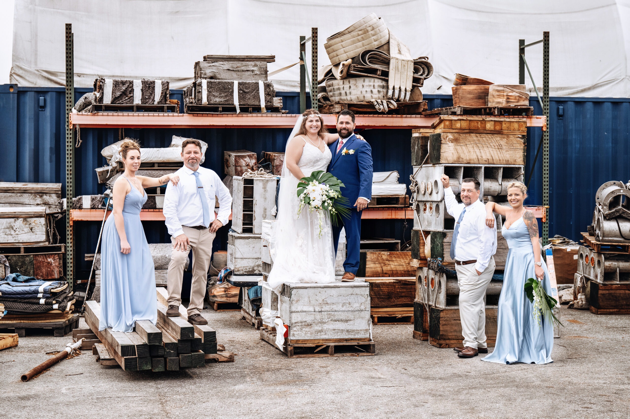 Bride and groom with bridal party at Rybovich Marina in Palm Beach, surrounded by nautical industrial textures — photographed by David Scarola Photography.