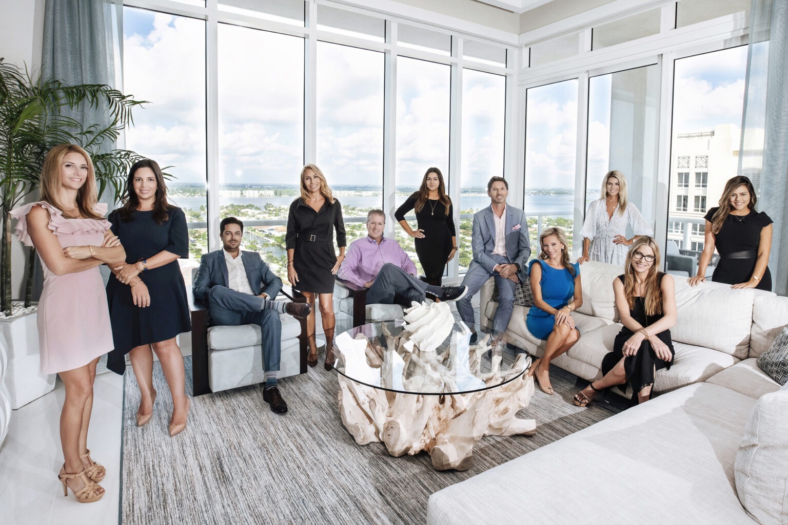 Douglas Elliman South Florida real estate team photographed in the Ritz-Carlton Residences Penthouse on Singer Island by David Scarola Photography. Corporate and professional team portrait of luxury realtors and brokers serving Palm Beach, Jupiter Island, and Miami.Douglas Elliman real estate team, luxury realtor photography Palm Beach, corporate team photo Singer Island, professional photographer South Florida, real estate marketing photography Miami, broker team portrait Florida, Ritz Carlton Residences photography, David Scarola Photography, luxury corporate headshots Palm Beach, business portraits Jupiter Island, professional branding photographer Florida.
