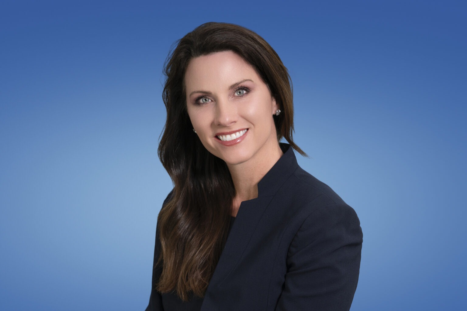 Professional studio headshot of a businesswoman photographed by David Scarola Photography. The portrait features clean lighting, a vibrant blue backdrop, and refined posing — showcasing confidence, professionalism, and approachability. Ideal representation of high-end corporate and executive headshot photography in South Florida, Palm Beach, Jupiter Island, and Miami. .professional headshots Palm Beach, Miami corporate headshot photographer, Jupiter Island executive portraits, studio headshots South Florida, best headshot photographer in Palm Beach, corporate photography Miami, business portrait photography Jupiter Island, creative professional portraiture Florida, David Scarola Photography, luxury headshots Palm Beach, executive portrait photographer South Florida, professional branding photography Miami.