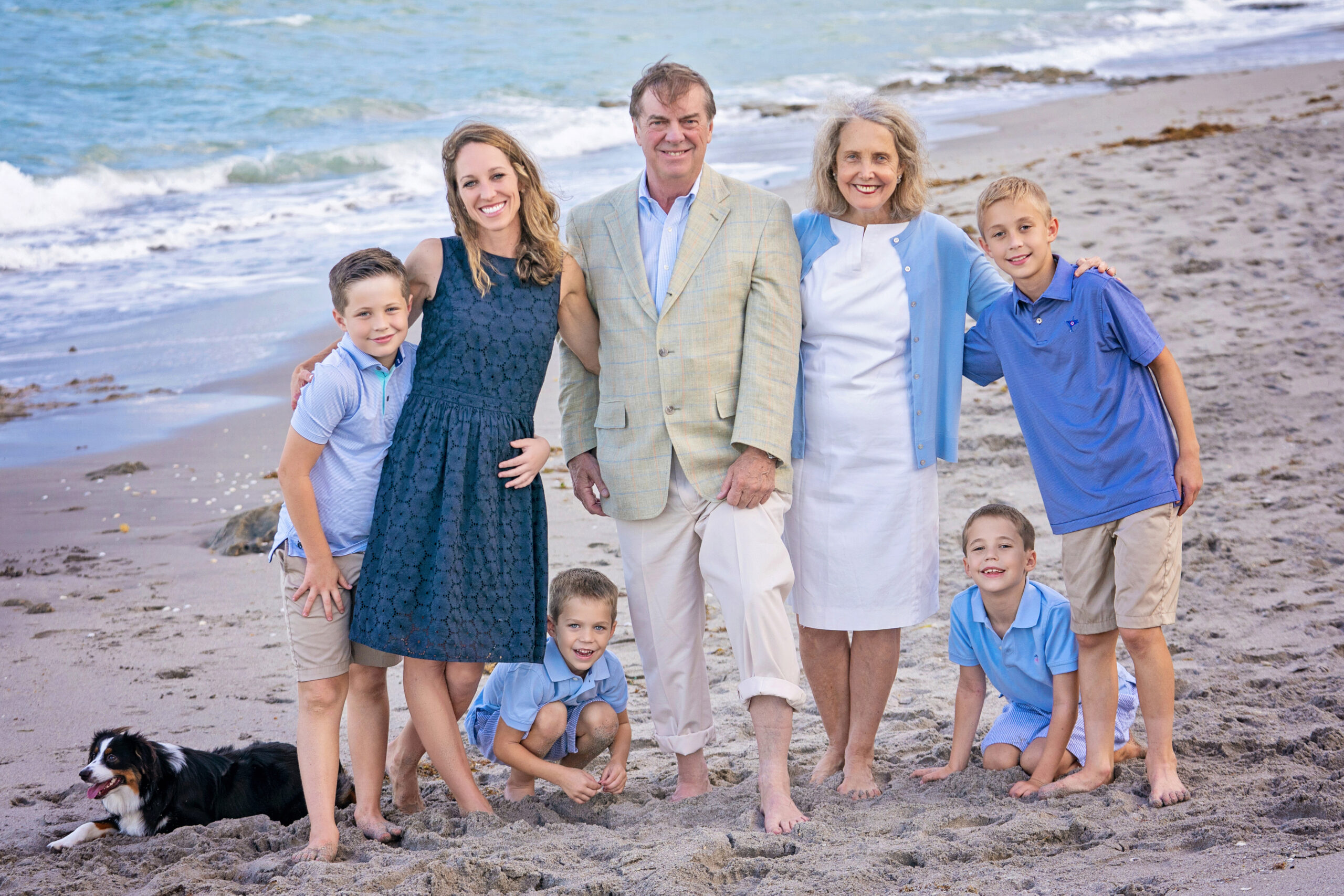 A marvelous family, posing during a family photo shoot with David Scarola, a gorgeous stretch of beach in Juno Beach, connected with the golfcourse community Seminole Landing.