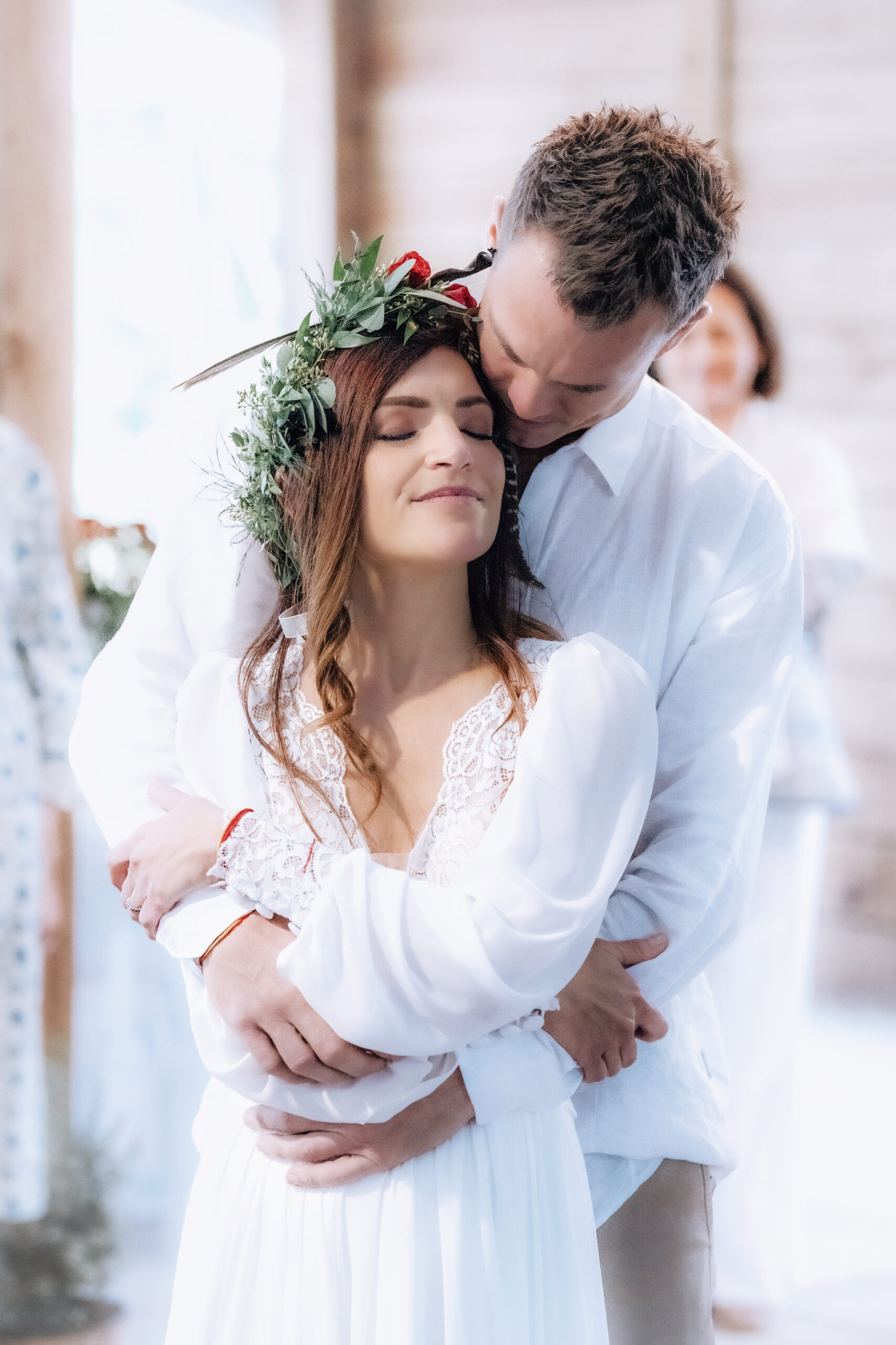 Bride and groom share a tender embrace during their wedding ceremony at Hawks Landing in Jupiter, Florida. Captured by acclaimed South Florida wedding photographer David Scarola, this intimate portrait radiates love, peace, and natural elegance in soft, ethereal light.