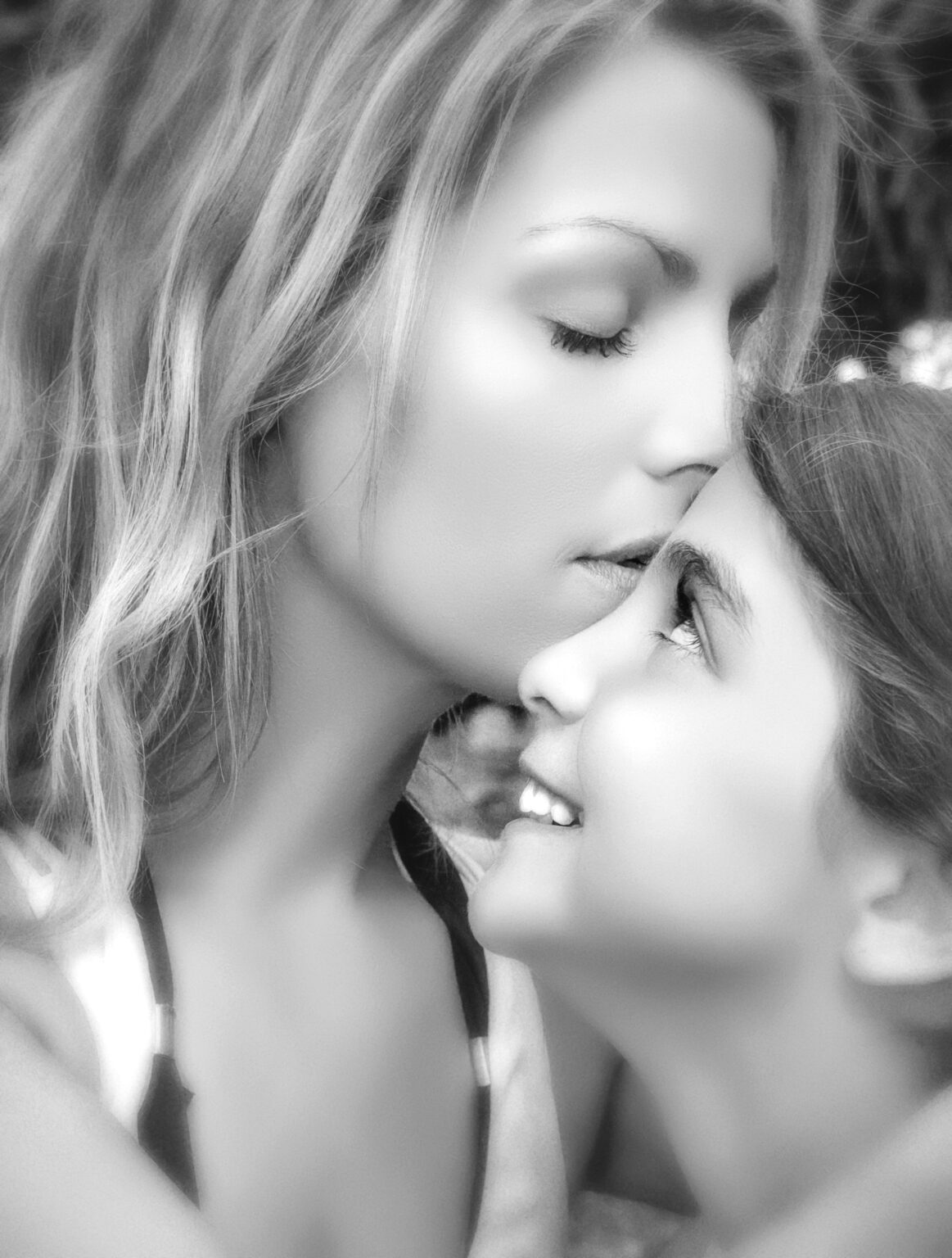 Palm Beach Island, once upon a time, Mother and daughter in a moment of adoration, captured in their family photography session with master portrait artist and family photographer, David Scarola.
