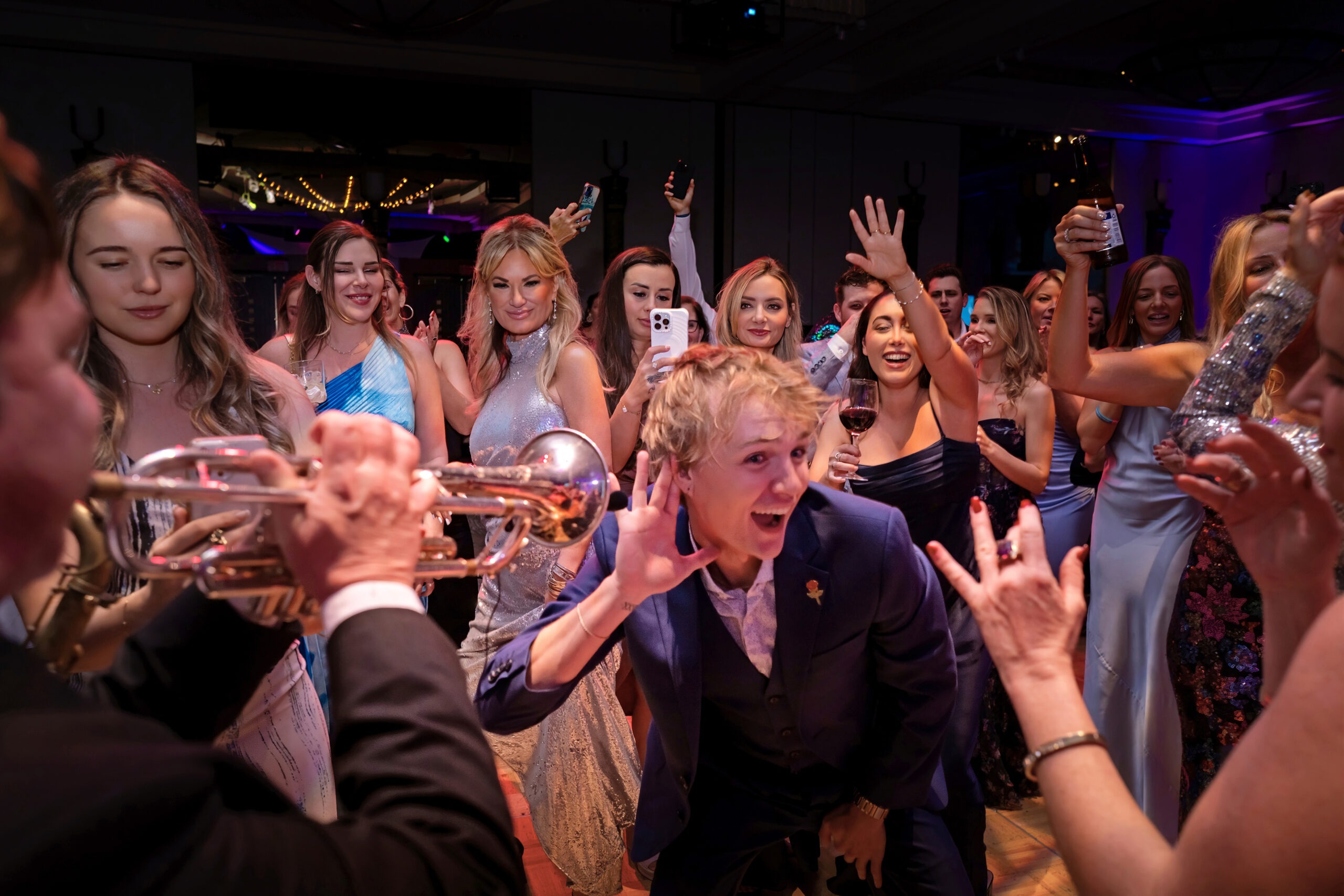uests dance and celebrate to live trumpet music during the Piper’s Angels Foundation Annual Gala at the Kravis Center in Palm Beach, captured in vibrant color and emotion by David Scarola Photography.