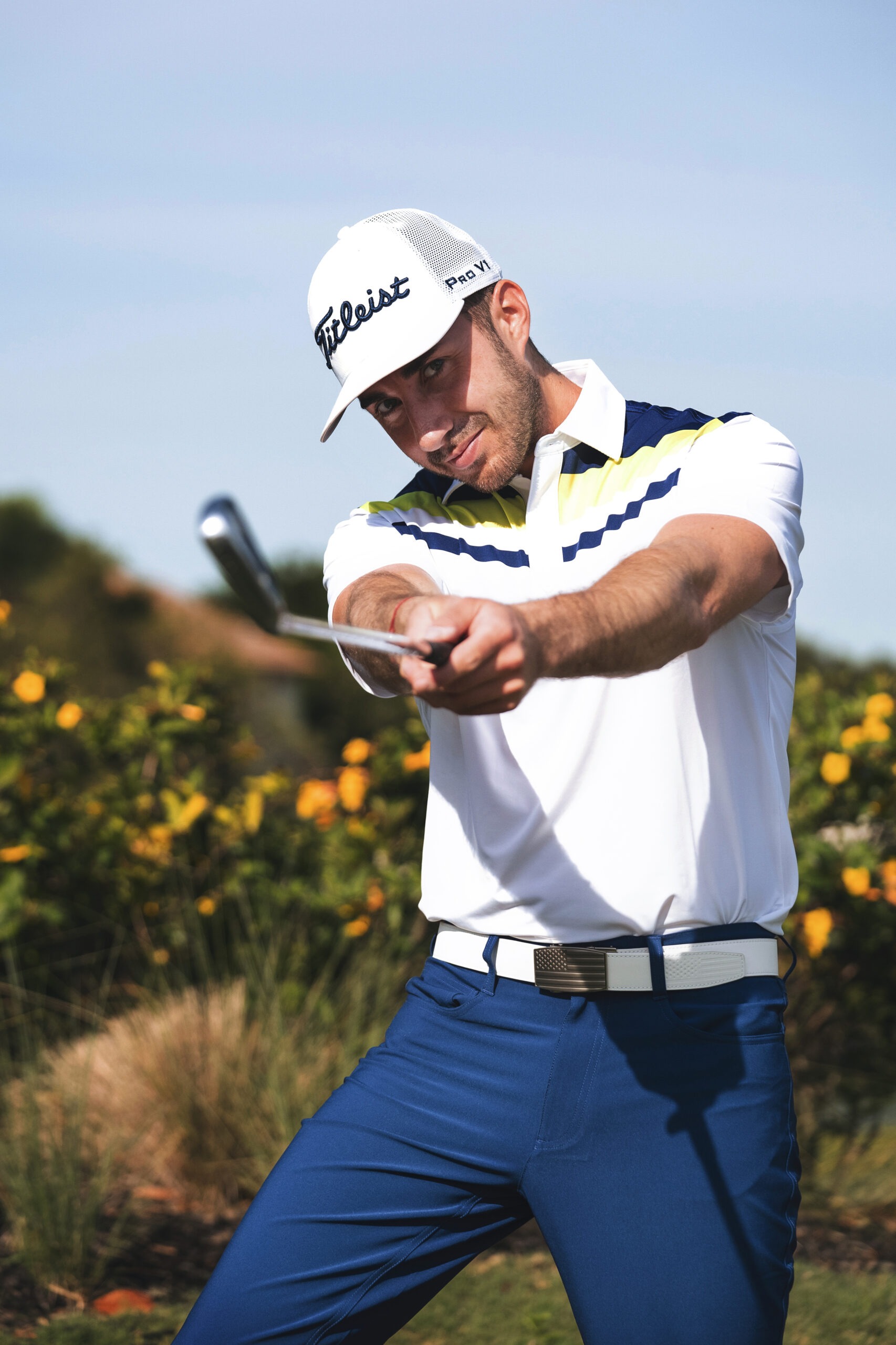 Professional golf and lifestyle portrait of Arnaud Serie, golfer, content creator, and brand influencer, during a Titleist photo shoot at Admirals Cove in Jupiter, Florida. Captured by David Scarola, one of the top commercial and lifestyle photographers in Palm Beach and the United States. The image features Arnaud mid-swing in a Titleist cap, white and blue golf attire, and a confident expression — showcasing the fusion of athletic precision, branding, and modern golf culture.David Scarola Photography, Titleist photoshoot, Arnaud Serie golf influencer, Admirals Cove Jupiter, golf lifestyle photographer Florida, Palm Beach commercial photographer, sports branding photography, professional golf photoshoot, Titleist campaign Jupiter Florida, influencer marketing photography, fine art sports photographer, luxury lifestyle photography Palm Beach, Jupiter professional photographer, golf and content creator branding, Titleist golf campaign, Scarola style photography, modern sports portraiture, Florida brand photographer, professional commercial photographer Palm Beach County.