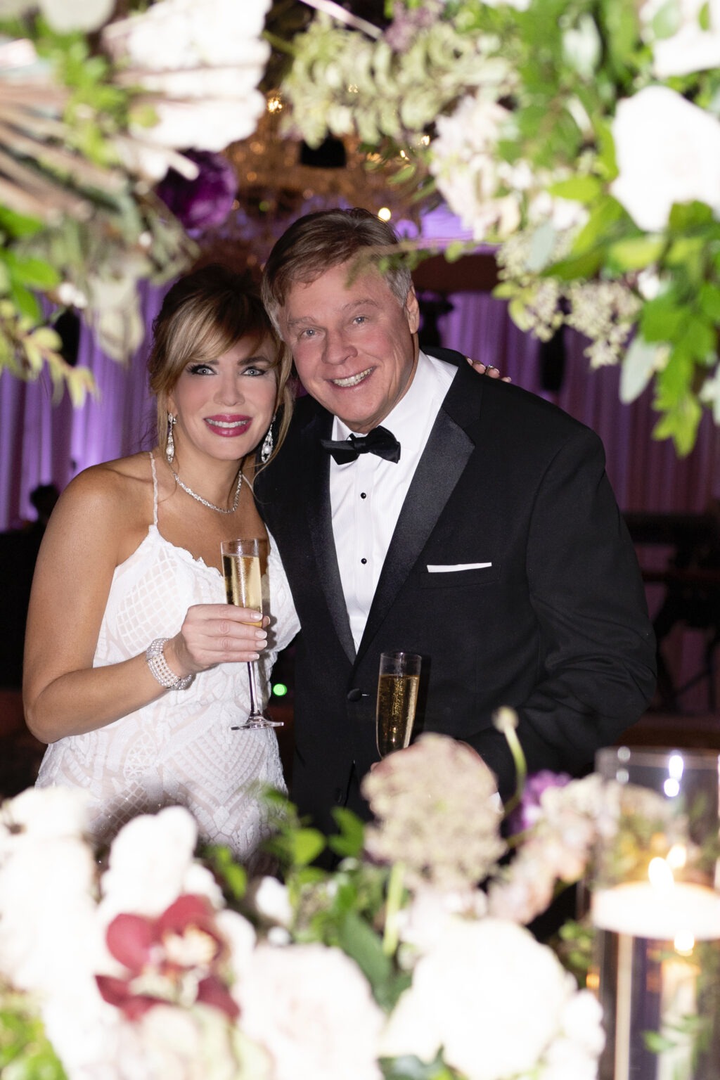Chris and Michelle Searcy celebrating their wedding day at The Eau Palm Beach Resort in Manalapan, Florida. Captured through elegant floral framing by David Scarola Photography — world-class wedding photography capturing love, luxury, and timeless connection.Eau Palm Beach wedding, Palm Beach wedding photographer, luxury wedding photography Florida, Chris and Michelle Searcy wedding, Manalapan wedding venue, David Scarola Photography, top wedding photographer Palm Beach, fine art wedding photography, destination wedding Florida, elegant wedding portraits, luxury event coverage Palm Beach.