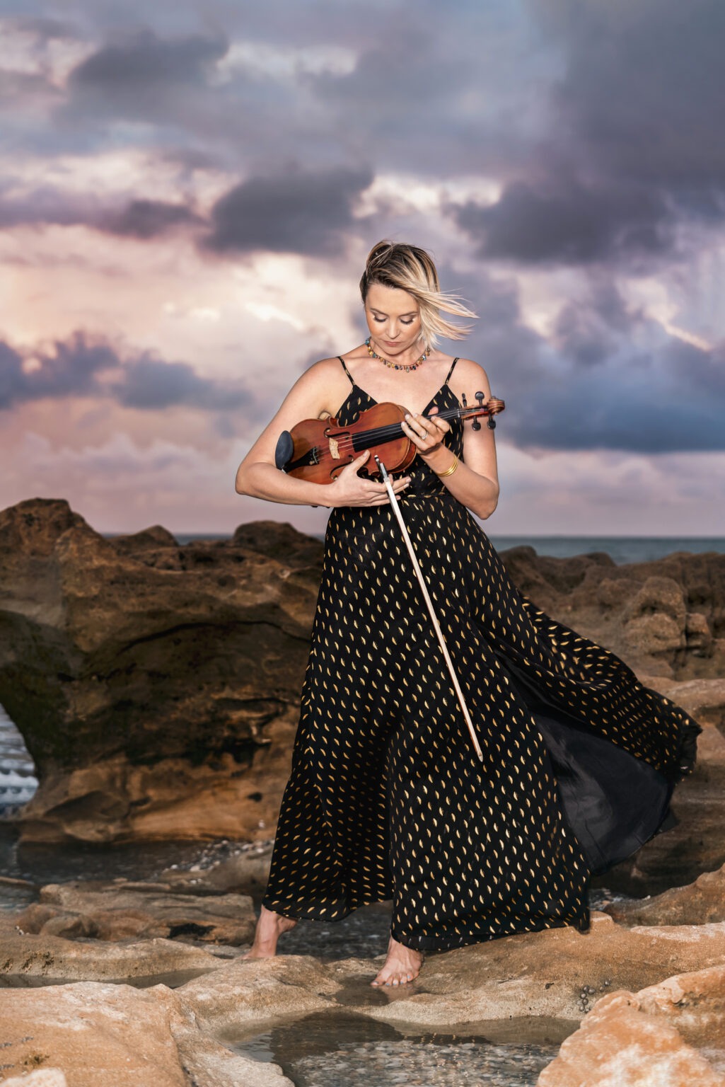 Bonnie, professional violinist, photographed by David Scarola at Coral Cove Beach in Jupiter, Florida. Fine art portrait blending music, nature, and elegance during sunset — part of a lifestyle branding session by David Scarola Photography, serving West Palm Beach, Miami, Key Biscayne, and Jupiter Island.David Scarola Photography, Bonnie violinist, musician portraits Florida, Coral Cove Beach photography, Jupiter Island photographer, Miami branding photographer, Key Biscayne portraits, West Palm Beach fine art photography, South Florida headshots, lifestyle musician portraits, editorial beach photography, professional violinist branding images, Palm Beach music portrait session.