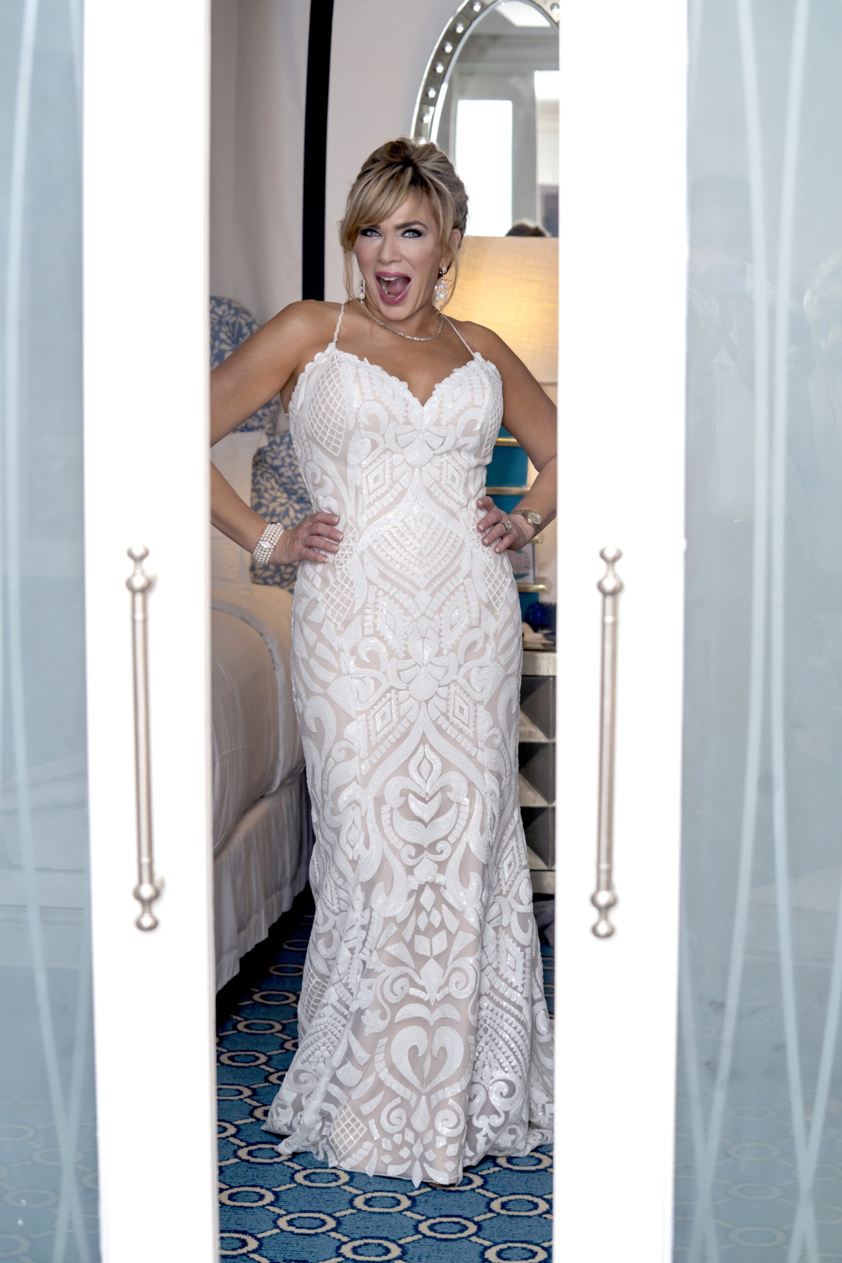 Michelle Searcy in the bridal suite at The Eau Palm Beach Resort, moments after putting on her wedding gown — an elegant, joy-filled portrait by David Scarola Photography capturing luxury, emotion, and timeless beauty in Palm Beach.Michelle Searcy wedding, Eau Palm Beach bridal suite, Palm Beach wedding photographer, luxury wedding photography, Manalapan wedding, David Scarola Photography, Palm Beach weddings, fine art bridal portrait, South Florida wedding photography, best wedding photographer Palm Beach, luxury destination weddings.