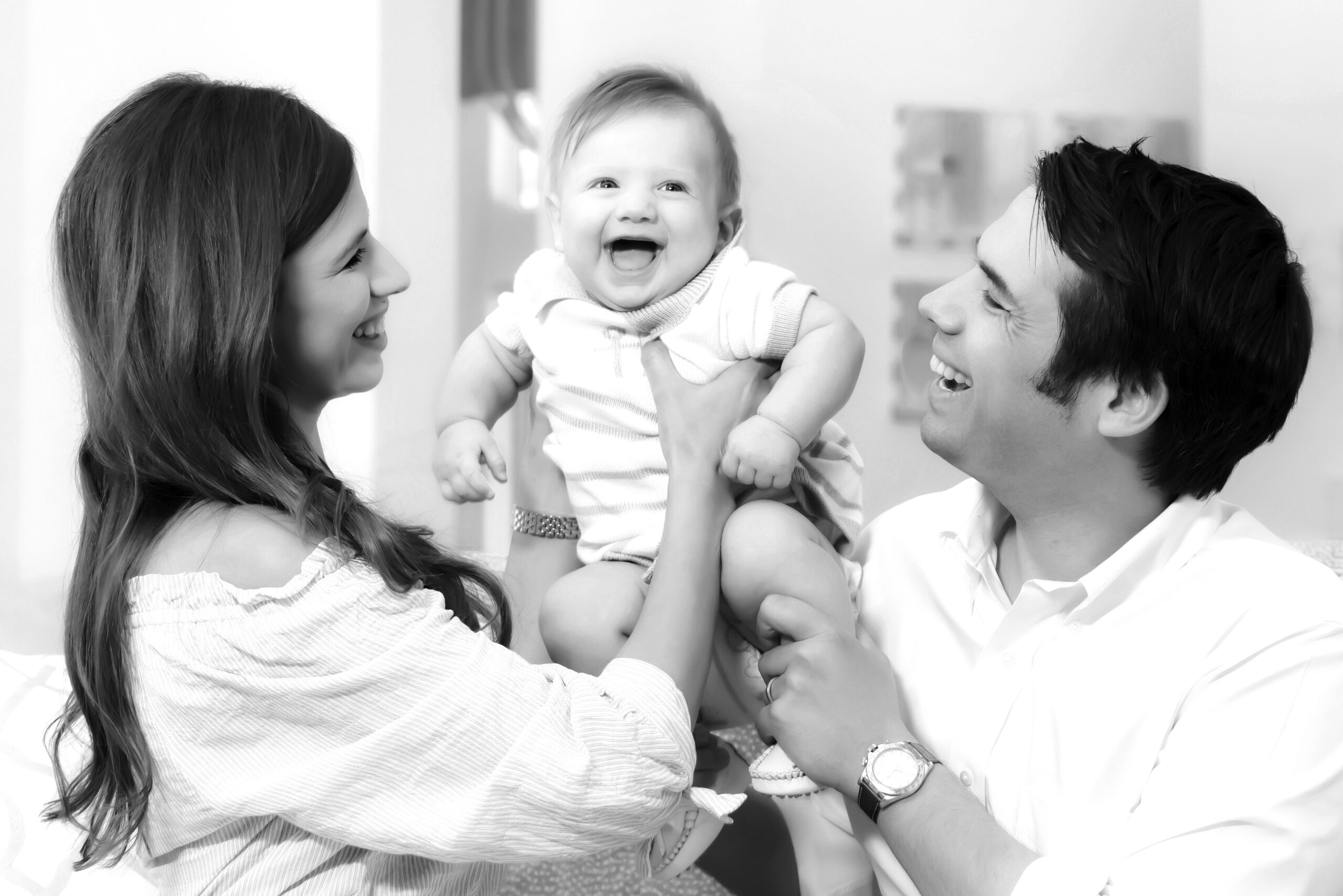 This young Palm Beach Island family is very happy, feeling love, fullness, joy, and delight during their first ever family portrait session, feeling comfortable and relaxed and open as David Scarola Photography guides the session through many poses and moments, capturing family portraits that will forever be cherished.