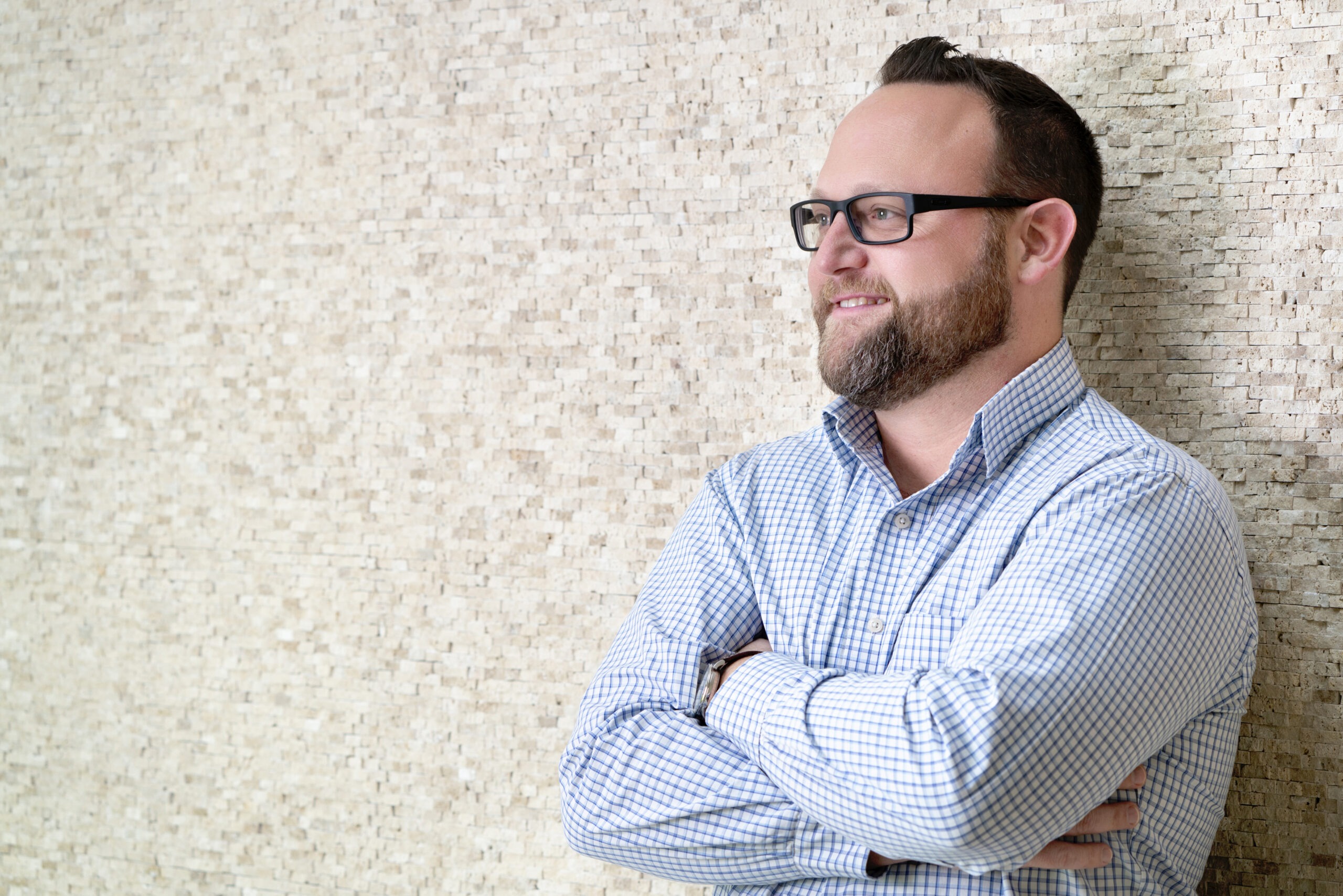 Dr. Eric Kiner, clinical psychologist, photographed by David Scarola Photography in Palm Beach County, Florida — professional portrait of a mental health expert in a modern setting.Dr Eric Kiner psychologist, professional headshot Palm Beach, psychologist portrait photography, mental health professional photo, therapist branding photography, clinical psychologist portrait, professional headshots Jupiter Island, healthcare branding photography, South Florida portrait photographer, corporate headshots Palm Beach, David Scarola Photography, best portrait photographer Florida, psychology marketing imagery, branding photography for therapists.