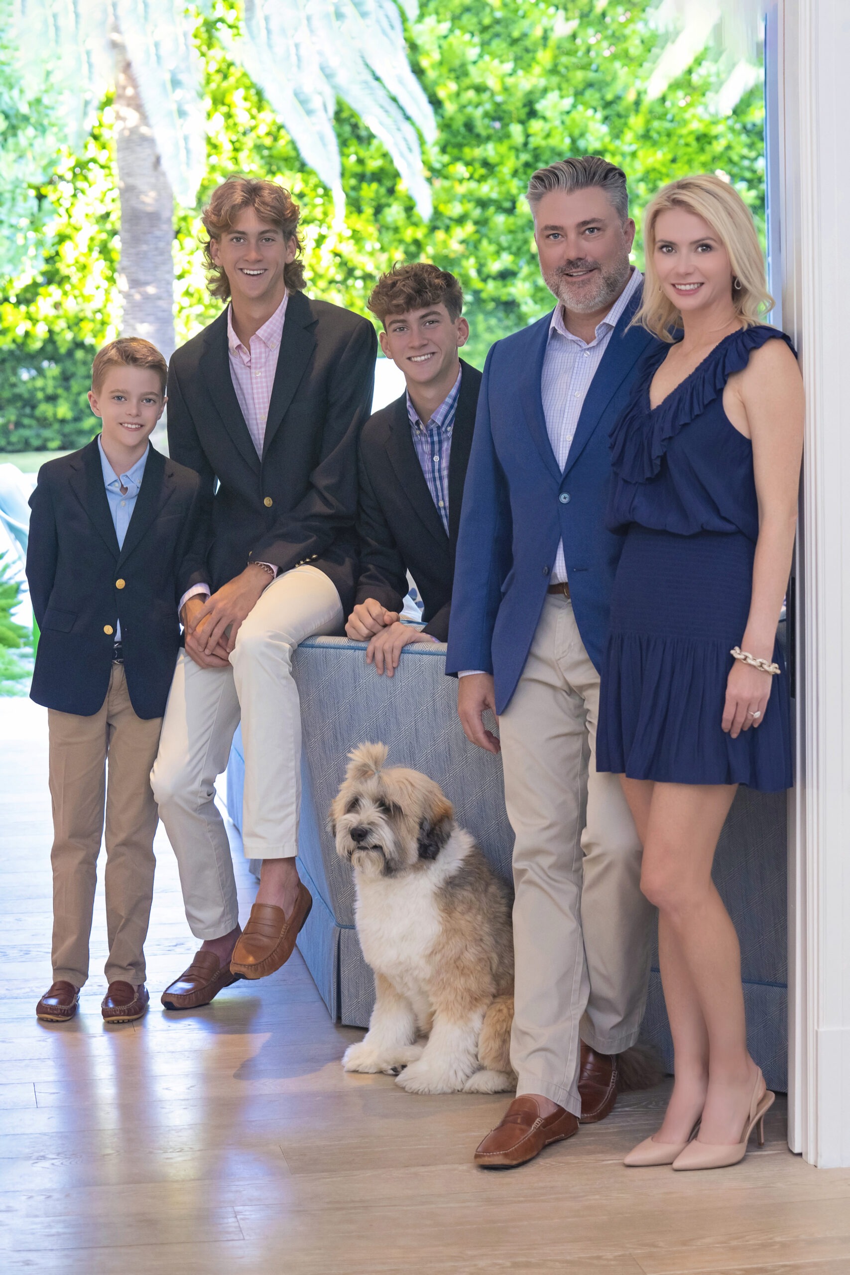 A wonderful family and client of David Scarola Photography posing happily in their Lost Tree Village Home in North Palm Beach, Florida during their annual family photo shoot.