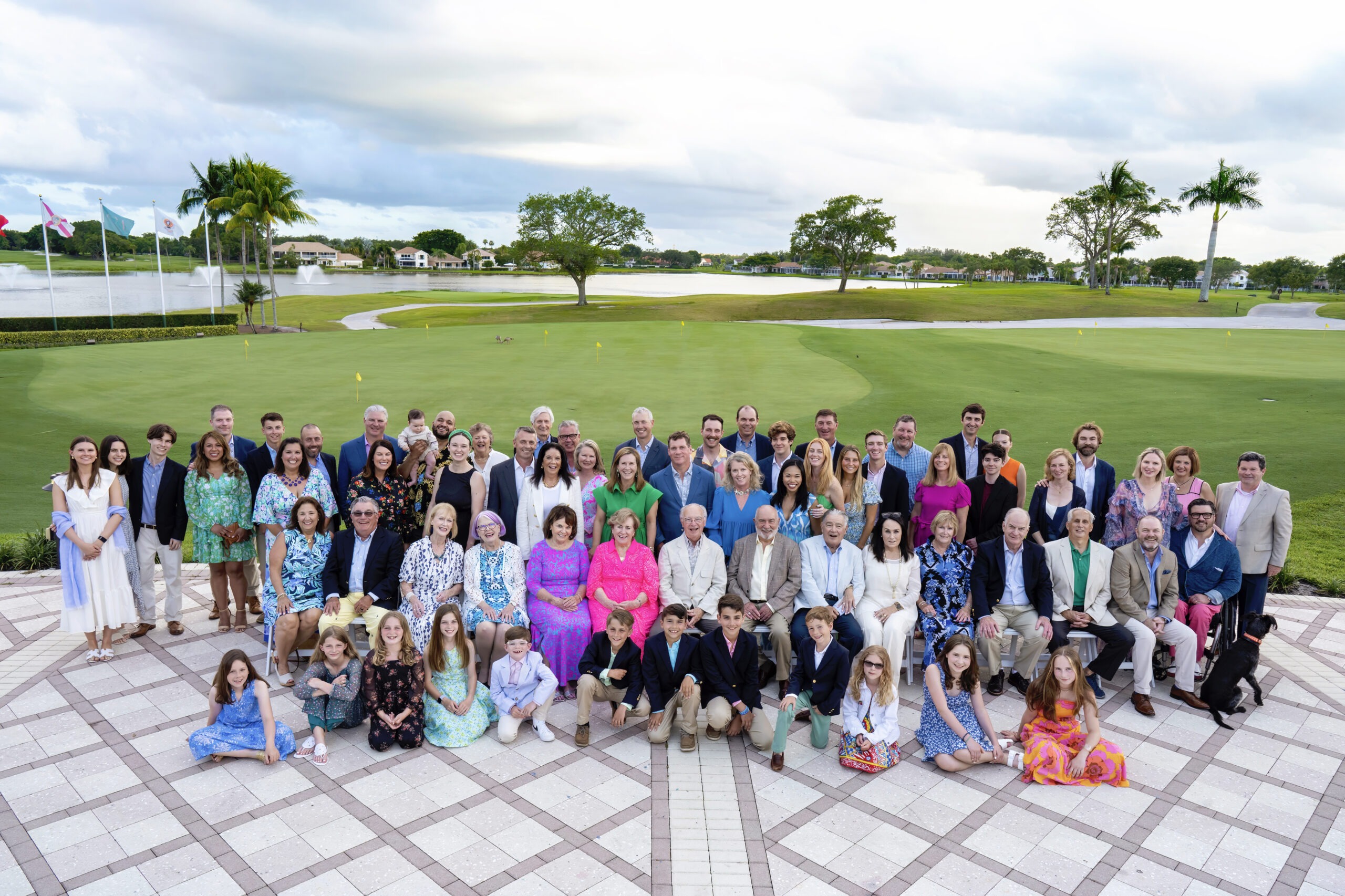 Large multi-generation family portrait celebrating Grandpa’s 80th birthday at PGA National Resort & Spa in Palm Beach Gardens, Florida. Captured by David Scarola Photography, specializing in family celebrations, milestone events, and large-group portraits.