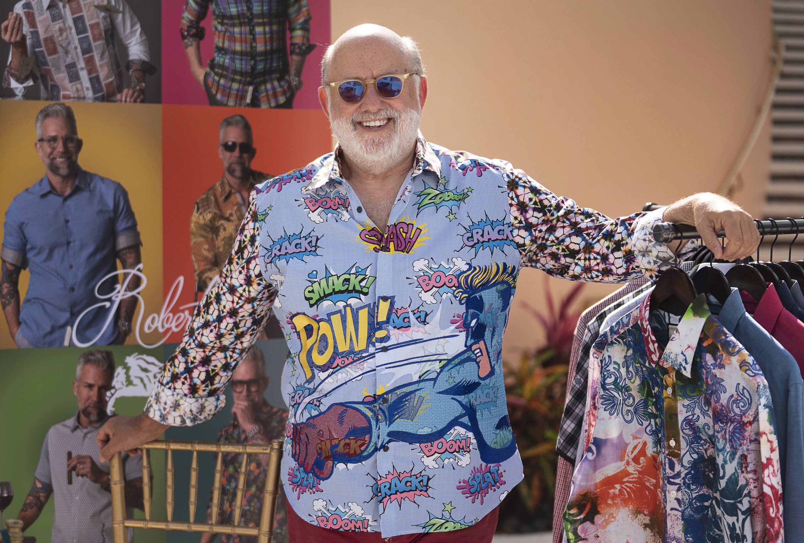 World-renowned fashion designer Robert Graham at The Palm Event at Mar-a-Lago, Palm Beach, showcasing his vibrant signature shirts inspired by pop art and luxury lifestyle design. Captured in natural light by David Scarola Photography, highlighting global event coverage and elite fashion presentation among the world’s most affluent collectors and art connoisseurs.Robert Graham fashion designer, Mar-a-Lago Palm Beach event, The Palm Event 2025, Palm Beach luxury photographer, high-end fashion photography, global event photographer, art cars Palm Beach, designer event coverage, elite events Palm Beach, fashion and philanthropy photography, luxury lifestyle photography, world-class event coverage, celebrity fashion portraiture, David Scarola Photography, global event photographer Palm Beach.