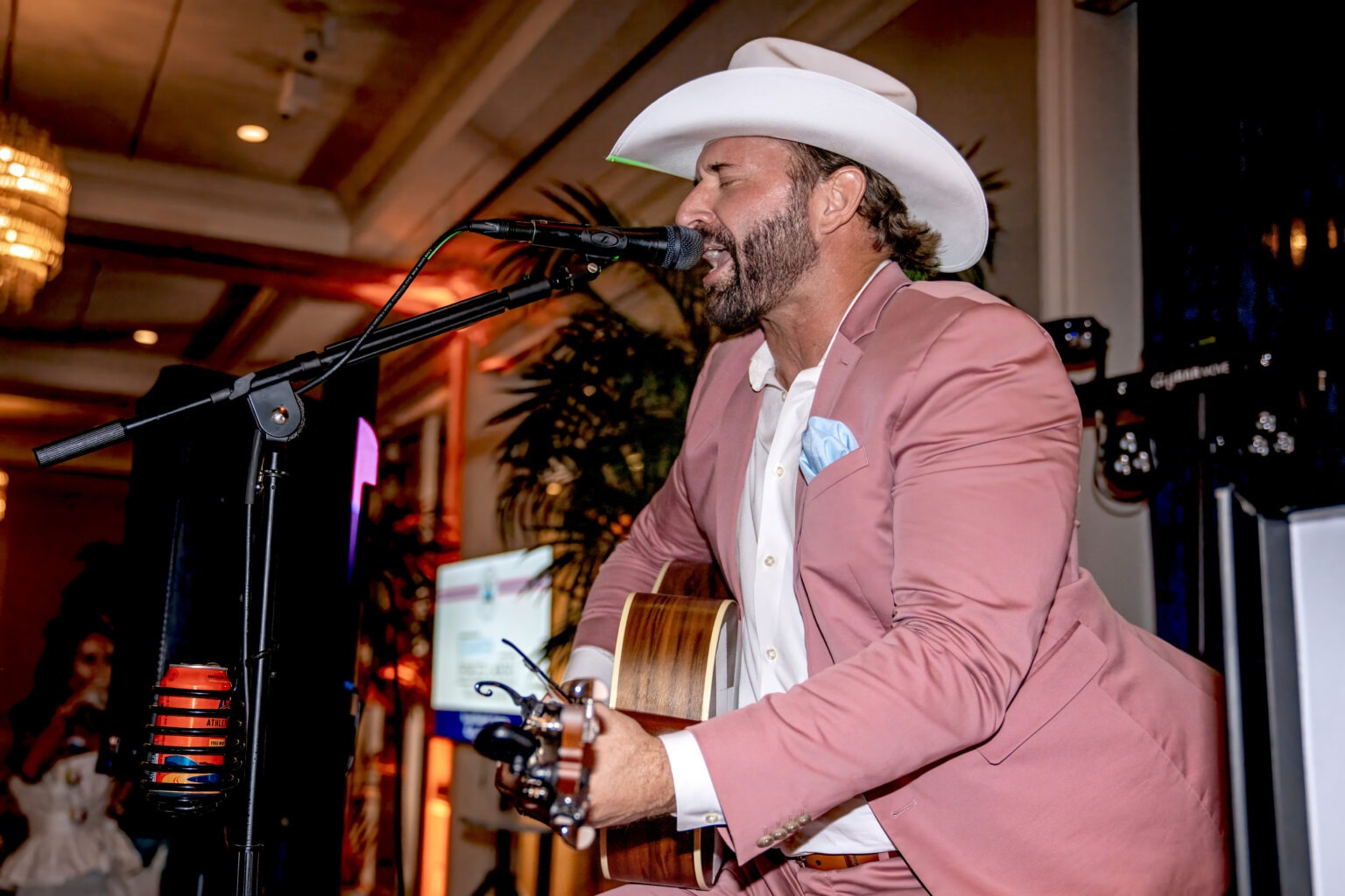 Country singer performs live at the Live Like Jake Gala at the Pelican Club in Jupiter Island, captured by David Scarola Photography during a luxury philanthropic event.Live Like Jake Foundation Gala, Pelican Club Jupiter Island event, Ricky Williams country singer performance, Palm Beach gala photographer, Jupiter Island luxury event photography, worldwide event photographer, global gala photographer, high-end corporate photographer, philanthropic event photography, David Scarola Photography, Palm Beach event photography, luxury lifestyle photographer, gala entertainment photography.
