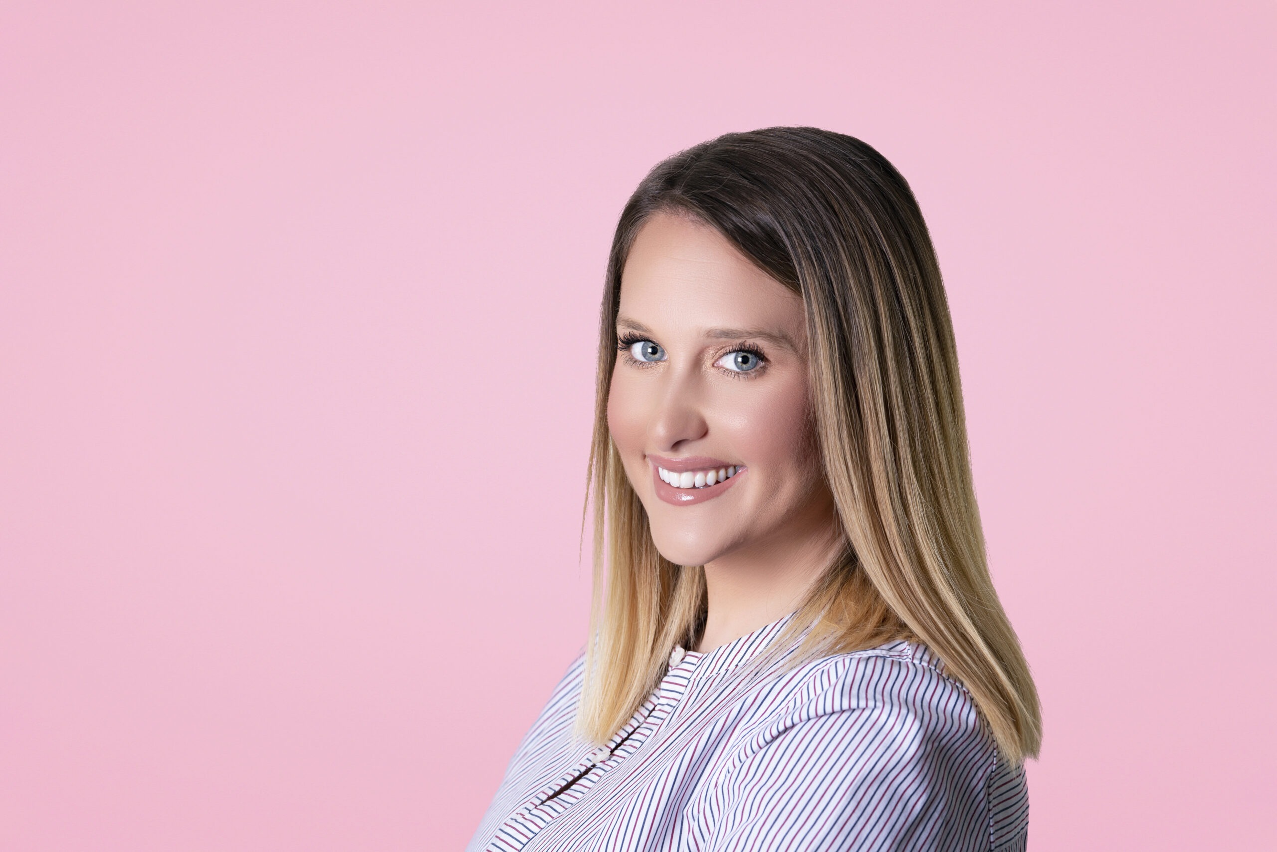 Professional studio headshot of a female entrepreneur and culinary artist in Palm Beach, photographed against a soft pink background — elegant, approachable, and expertly lit portrait by David Scarola Photography, master of professional portraits and corporate headshots in Palm Beach, Miami, Jupiter Island, Key Biscayne, and West Palm Beach.