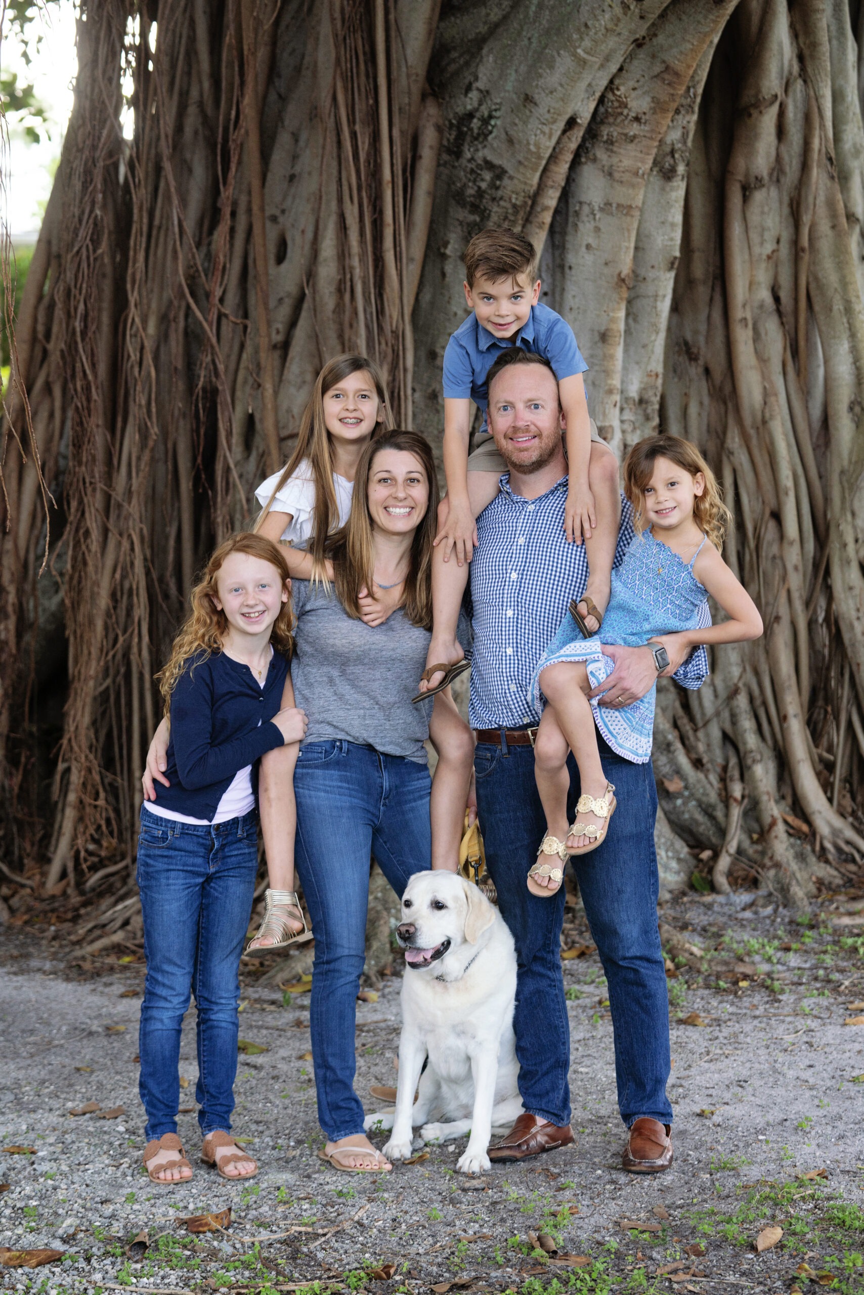 "Dad," Says David Scarola, "put the little guy on your shoulders, and the little girl in your arms, and let's make a gorgeous family portrait by this wonderful banyan tree on Jupiter Island."