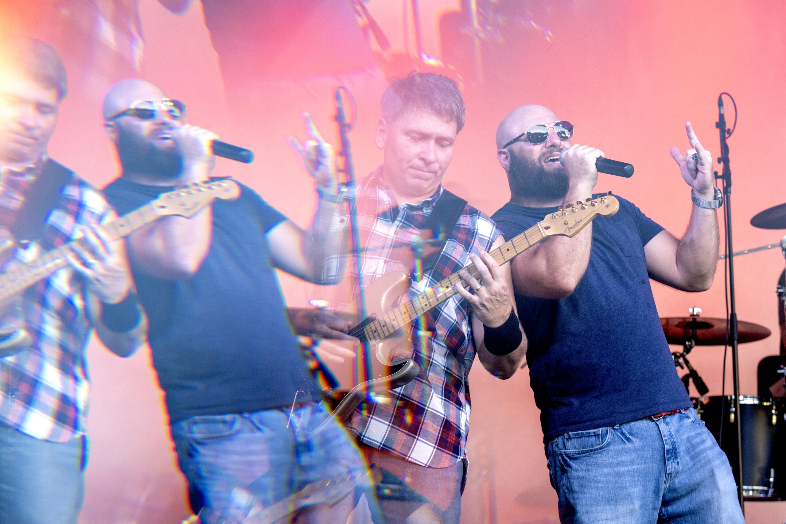 Rock band performing live at the iTHINK Financial Amphitheatre — vibrant concert photography capturing the electric energy of Disbarred on stage, with bold lighting, expressive vocals, and dynamic motion blur. Professional event photography by David Scarola Photography, specializing in live music, festivals, and high-end performance coverage in Palm Beach, Jupiter, and South Florida.