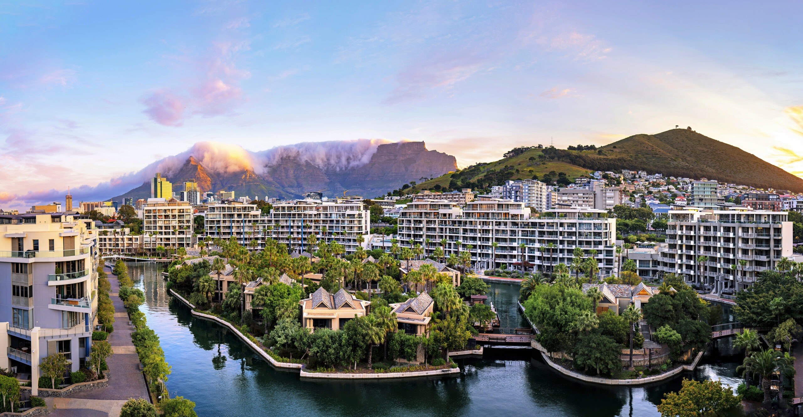 Luxury view from the Presidential Suite at The One & Only Cape Town overlooking the city, the marina, and Table Mountain at sunrise — captured by David Scarola, global event and fine art photographer.The One and Only Cape Town Presidential Suite, luxury hotel photography South Africa, Table Mountain view photography, Cape Town luxury resort, David Scarola Photography, global luxury event photographer, fine art travel photography, destination event photographer, world-class hotel photography, elite corporate retreat photography, five-star resort imagery, high-end hospitality marketing photography, Cape Town presidential suite view.